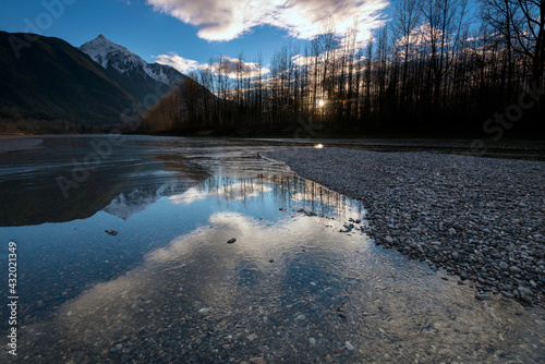 Mt. Cheam reflected into the Fraser River, Fraser Valley, Canada. photo