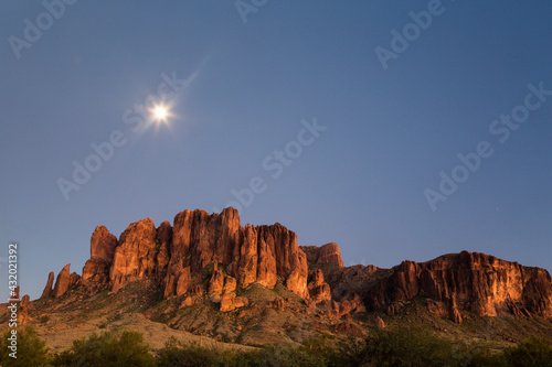 The moon rising above the western Superstition Mountains, Lost Dutchman State Park, Arizona photo