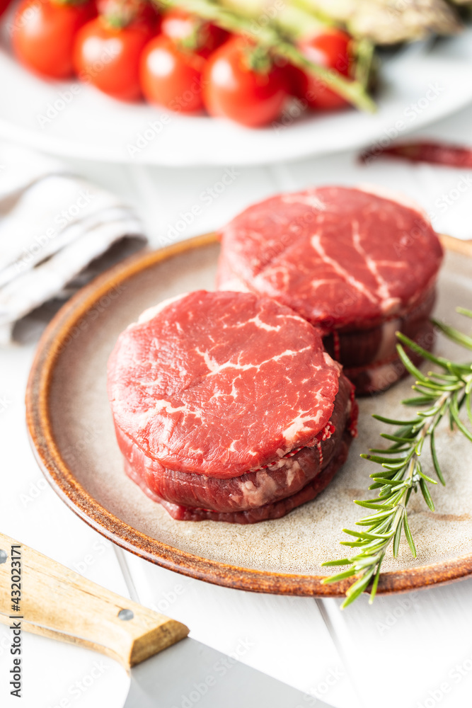 The raw beef meat steak on plate. The raw beef meat steak on plate.