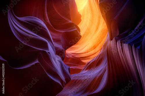 A kaleidoscope of warm and cool colors created by reflected light in a remote Arizona slot canyon. photo