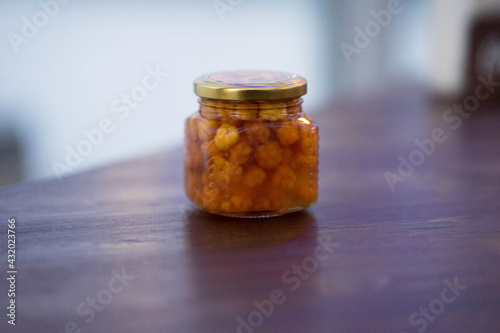 glass jar with cloudberry jam