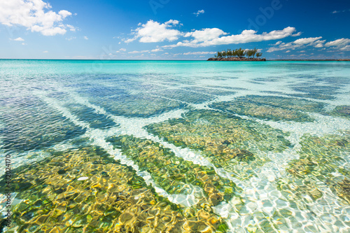 Calm waters of the Caribbean with a small island in The Bahamas. photo