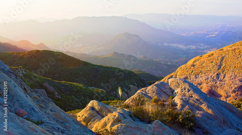 Santa Monica Mountains Nat. Recreation Area, Malibu, CA: Sunset over 11 layers of mountains with lone yucca in the center shot