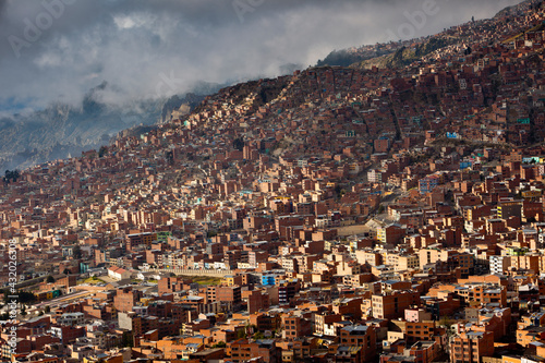 The sky-high capital city of La Paz, Bolivia lies in a deep canyon below the Andes Mountains. photo