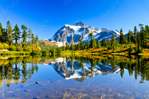 North Cascades National Park, Washington: Mount Shuksan's reflection on Picture Lake in the fall. photo