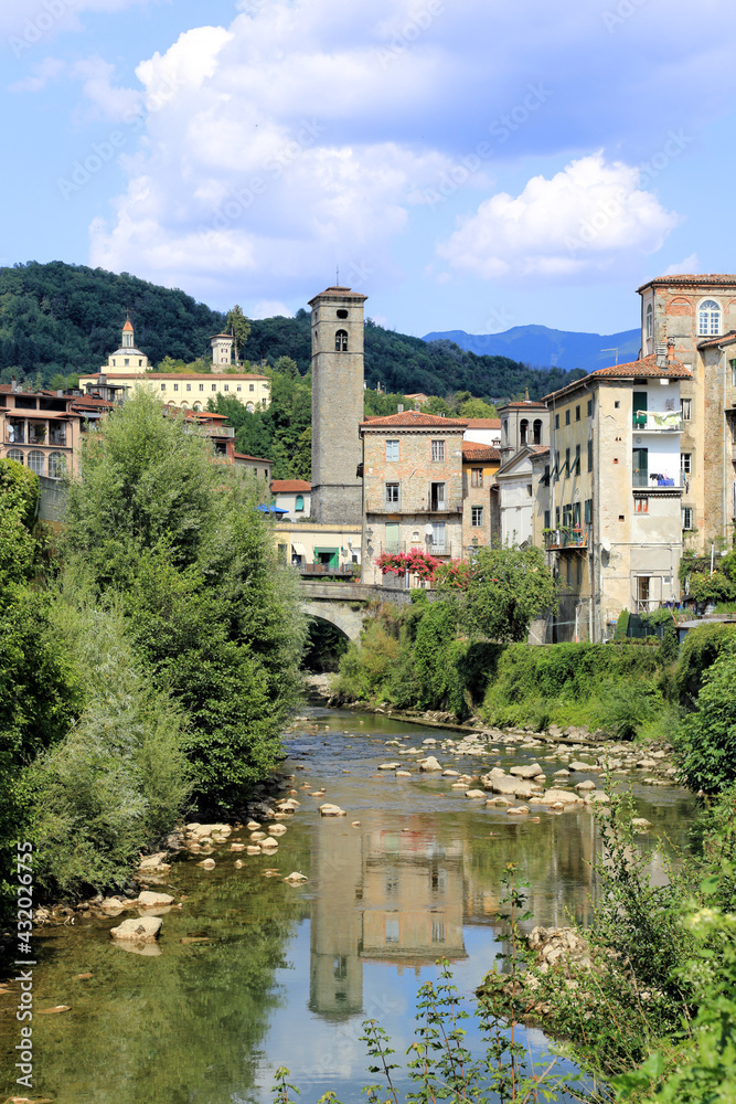 City view of Castelnuovo Garfagnana historical village and the river. View of the historic Tuscany town against the wonderful natural scenary of Garfagnana.