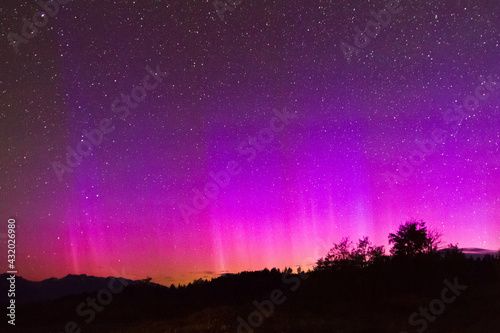 The northern lights glow above Shadow Mountain in the Bridger-Teton National Forest, Wyoming.