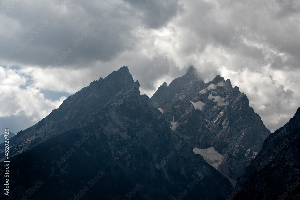 dramatic light and clouds on the Tetons in grand teton national park