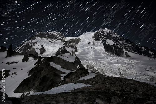 Mount Rainier with star trails as seen from Tokoloo Ridge - Mount Rainier National Park