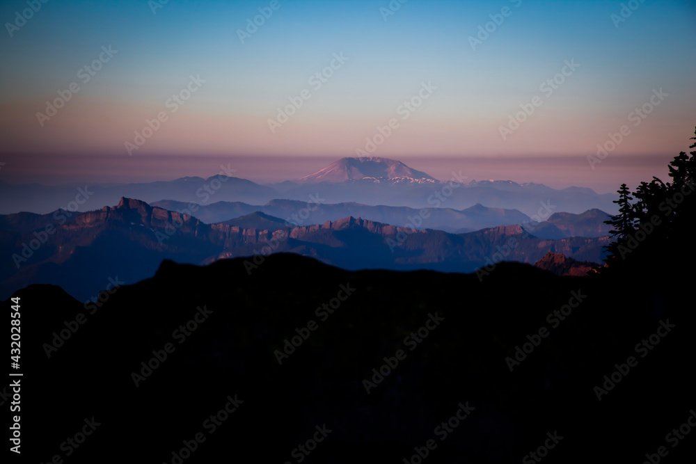 Sunset with Mount Saint Helens on the horizon - viewed from Mount Rainier - Mount Rainier National Park, WA Sunset with Mount Saint Helens on the horizon - viewed from Mount Rainier - Mount Rainier National Park, WA