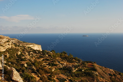 View from Dingli Cliffs in Malta island with the small noname island in background photo