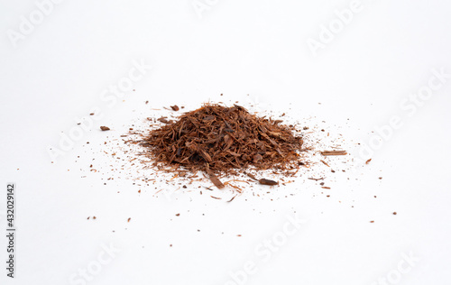 Lapacho bark (Handroanthus impetiginosus plant) scattered on a white background. Naturopathy remedy photo