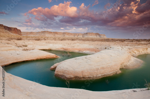 Scenic landscape image of Lake Powell, UT at sunset.