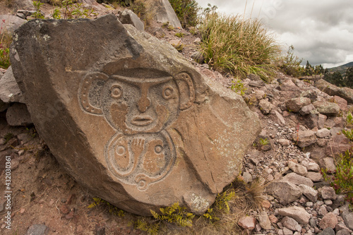 Ancient petroglyphs of a monkey carved on a rock in Puyo, Ecuador. photo