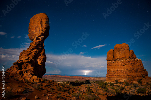 A Midnight Storm. An almost full moon lit up Balanced Rock in Arches National Park.