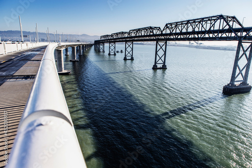 The San Francisco' Oakland Bay Bridge is a complex of bridges spanning San Francisco Bay, California, USA photo