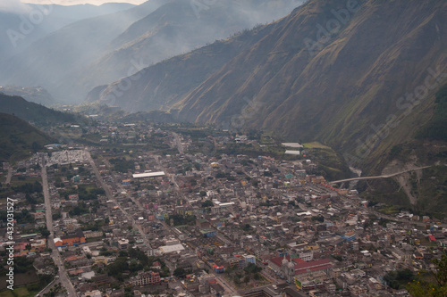 The city of Banos, Ecuador sprawls at the base of active volcano Tungurahua. photo