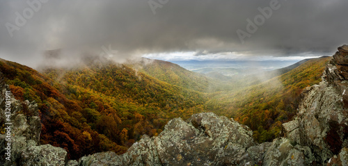 Autumn landscape from the mountains looking over the colorful forest, Shenandoah National Park, USA.