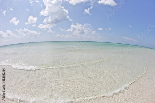 white sand beach with crystal clear water in the gulf of Mexico on anna maria island, Florida photo