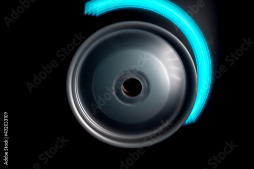 long exposure photography in motion spinning car titanium rims in blurry light