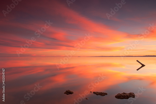 Reflected sunset on the Salton Sea, California photo