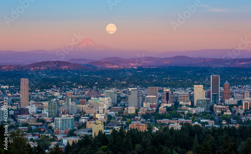 Full moon rises behind Portland, Oregon photo