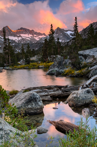 Thunderstorm clouds begin to clear and usher in a spectacular sunset in the John Muir Wilderness, CA.