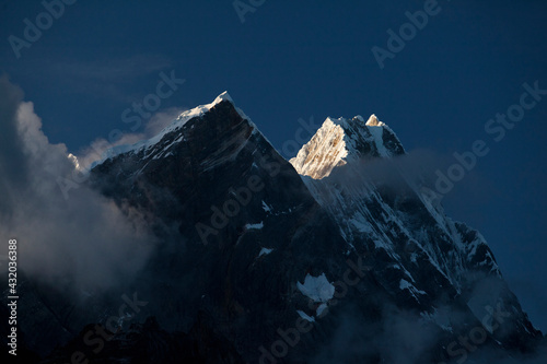 First light hitting Rondoy at 5879 meter in the Cordillera Huayhuash of the Andes Mountains in Peru. photo