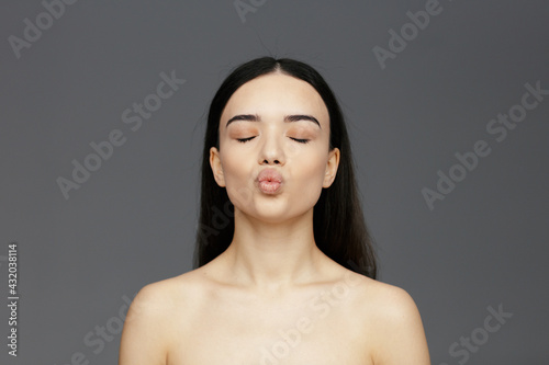 Young beautiful woman face close-up