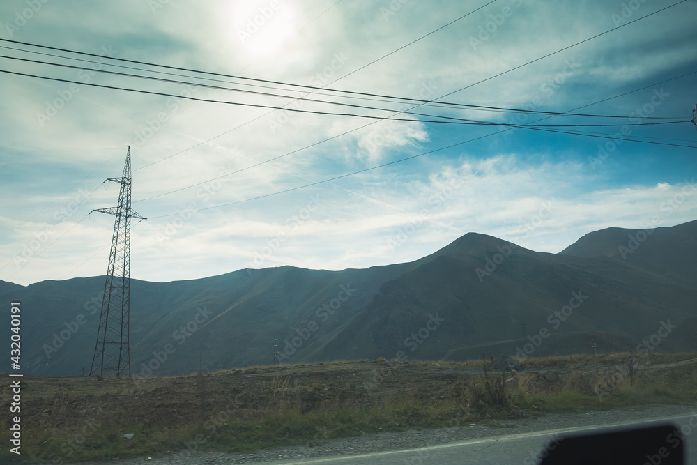 Panorama overlooking the mountains in the clouds. Landscape of the Caucasus Mountains. Fall. Day Georgia. Panorama overlooking the mountains in the clouds. Landscape of the Caucasus Mountains. Fall. Day Georgia.
