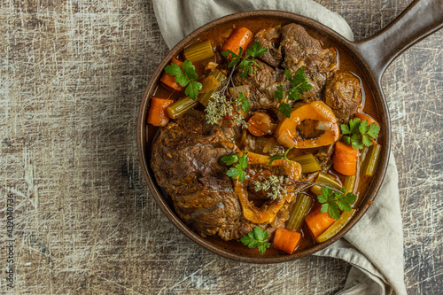 Osso buco traditional italian meat dish served in pan