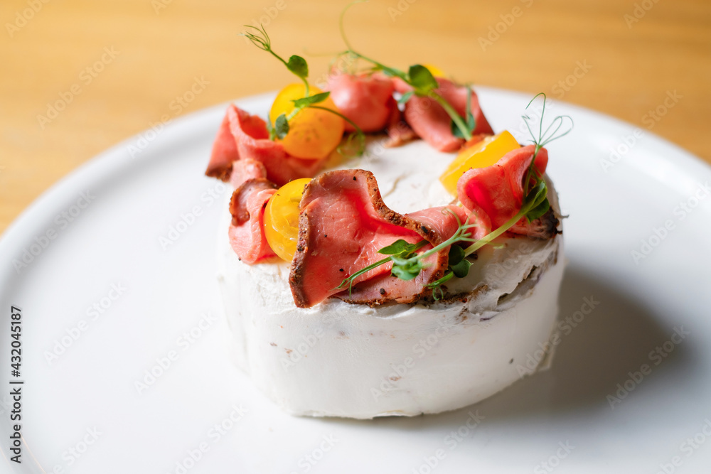 pie with cheese, vegetables and ham on white plate. pie with cheese, vegetables and ham on white plate.