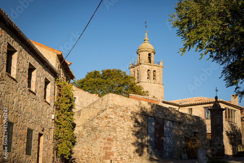 a street in Medinaceli with a view to the Collegiate Church of our lady of Assumption, province of Soria, Castile and Leon, Spain photo