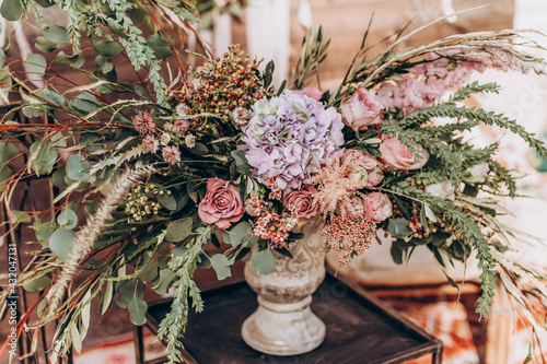 Wedding arrangement of natural flowers in boho style. photo