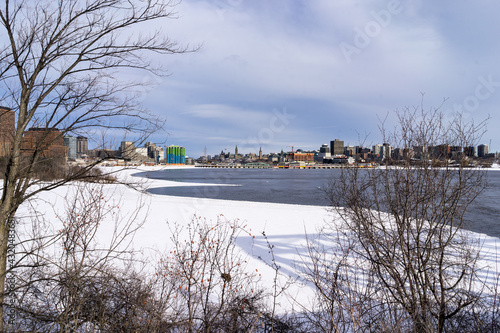 View of Ottawa and Gatineau from Prince of Wales Bridge with a view of Zibi under construction.  photo