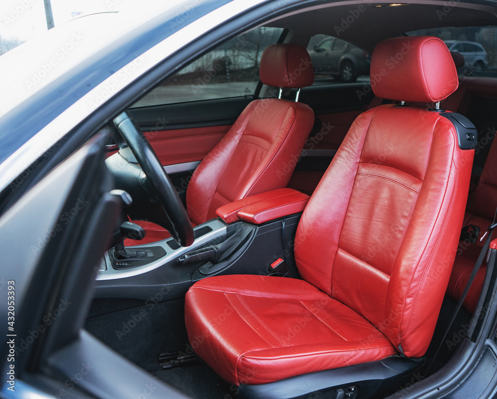 Luxury car interior with red leather seats and black details Luxury car interior with red leather seats and black details
