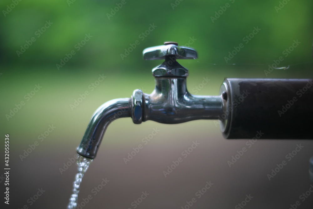 Tokyo,Japan-May 6, 2021: Water running from a tap
Tokyo,Japan-May 6, 2021: Water running from a tap