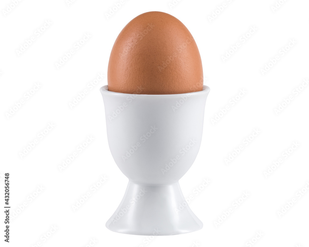 Egg in Egg cup. Ceramic eggcup for breakfast. Holder stand for boiled or raw chicken eggs on white isolated background. Macro close-up photography. Egg in Egg cup. Ceramic eggcup for breakfast. Holder stand for boiled or raw chicken eggs on white isolated background. Macro close-up photography.