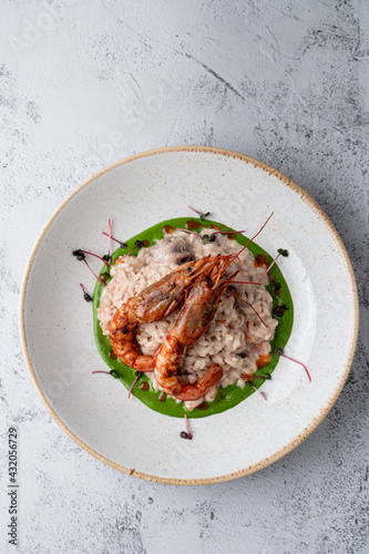 Top view of expensive risotto with big prawns
