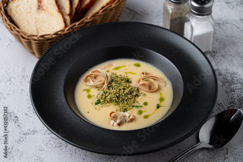 Menu photography setting for a restaurant, cheddar cheese soup, top view on a gray stone table