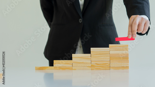Business Risk Businessman defends the wood block on the table, planning and strategy in alternative business risks