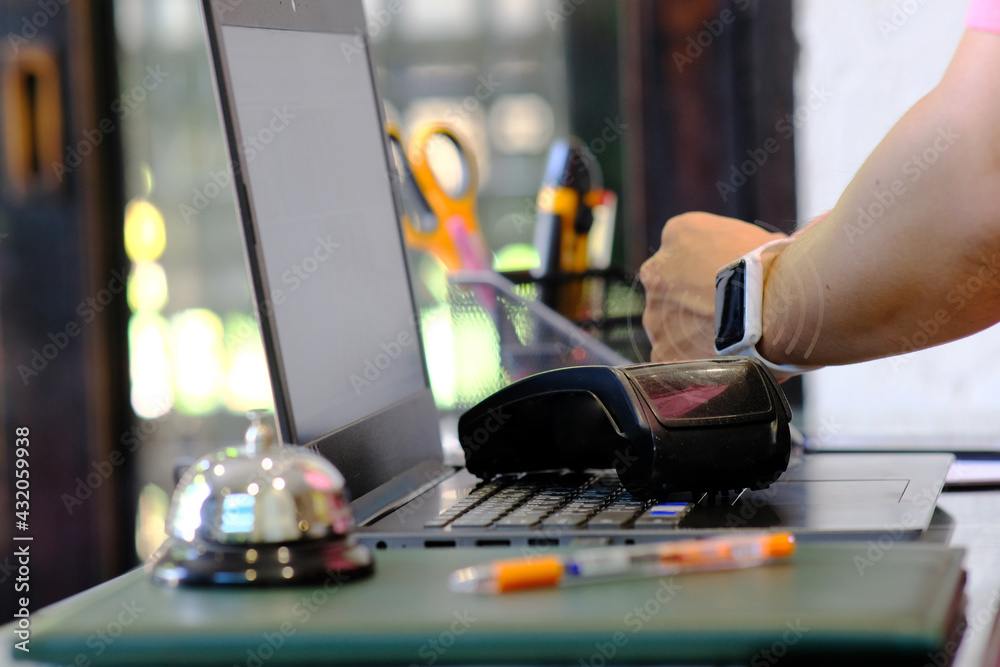 Person using smart watch for contactless payment and near field communication smartwatch payment Person using smart watch for contactless payment and near field communication smartwatch payment