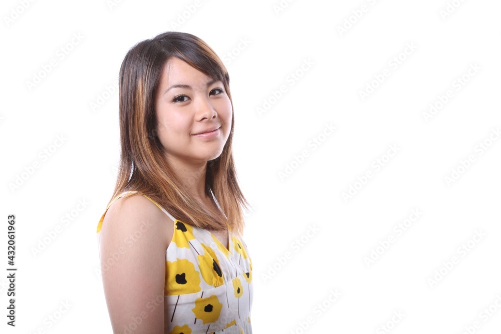 A young Japanese woman smiling at the camera A young Japanese woman smiling at the camera