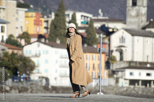 Elegant woman walking on the street photo