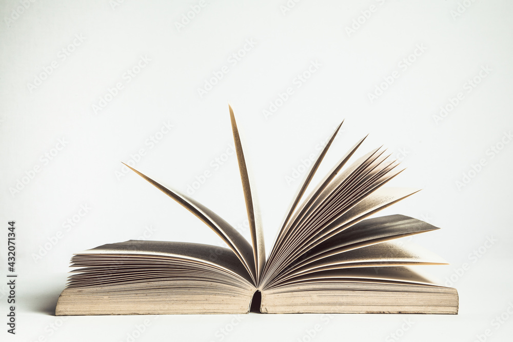 Fototapeta premium An open book isolated on white background