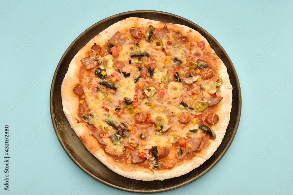 pizza with olives and cheese on blue background pizza with olives and cheese on blue background