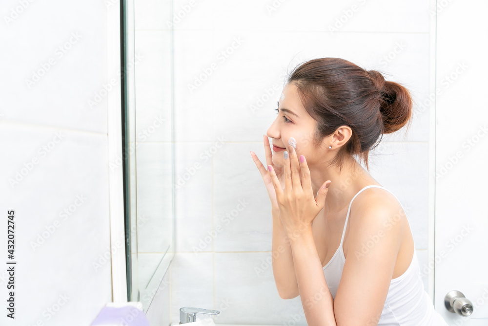 Young beauty woman washing her face in bathroom. Young beauty woman washing her face in bathroom.