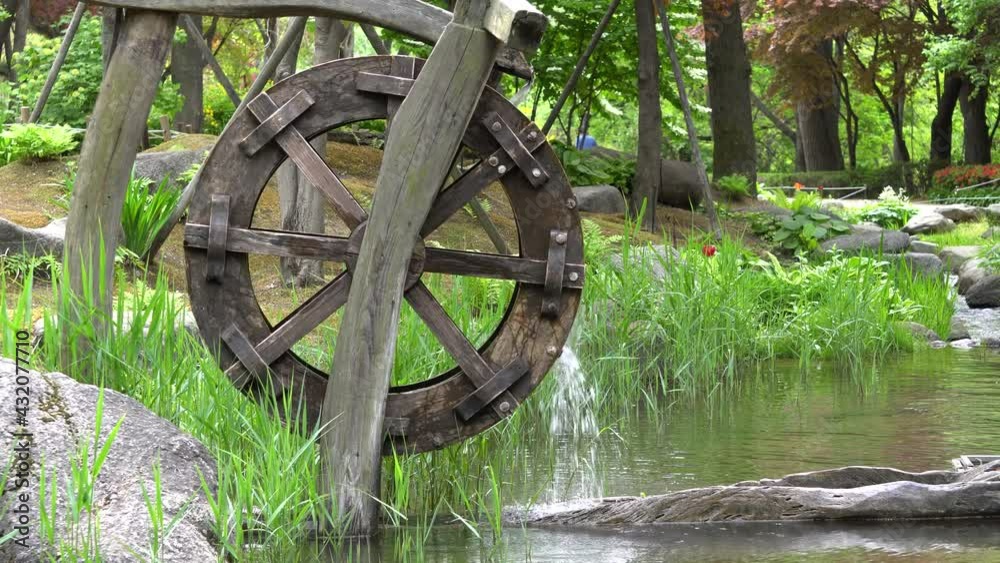 Traditional Wooden Water Wheel In Namsan Park, Seoul, South Korea - close up Traditional Wooden Water Wheel In Namsan Park, Seoul, South Korea - close up