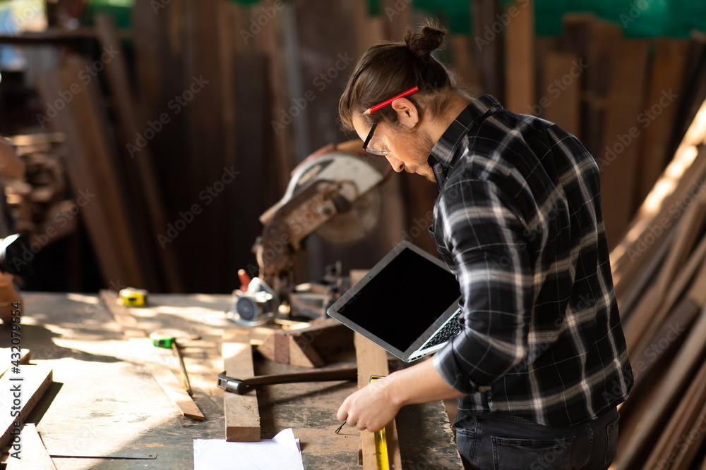 Carpenter woking at wood workshop. Construction industry concept. Tools for woodwrok pencil hammer meter and screw-driver. Carpenter woking at wood workshop. Construction industry concept. Tools for woodwrok pencil hammer meter and screw-driver.
