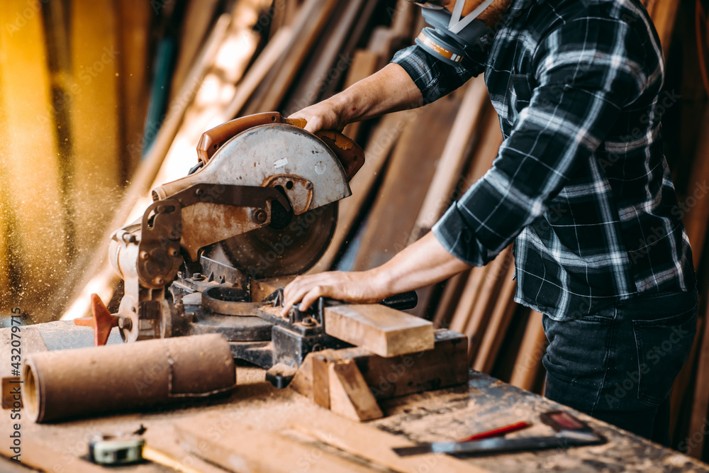 Carpenter work with electrical planer in carpentry workshop. Construction industry concept. Carpenter work with electrical planer in carpentry workshop. Construction industry concept.